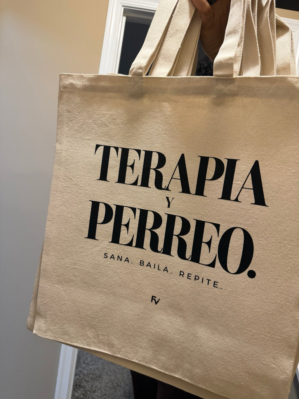 Terapia y Perreo natural canvas tote bag with black print